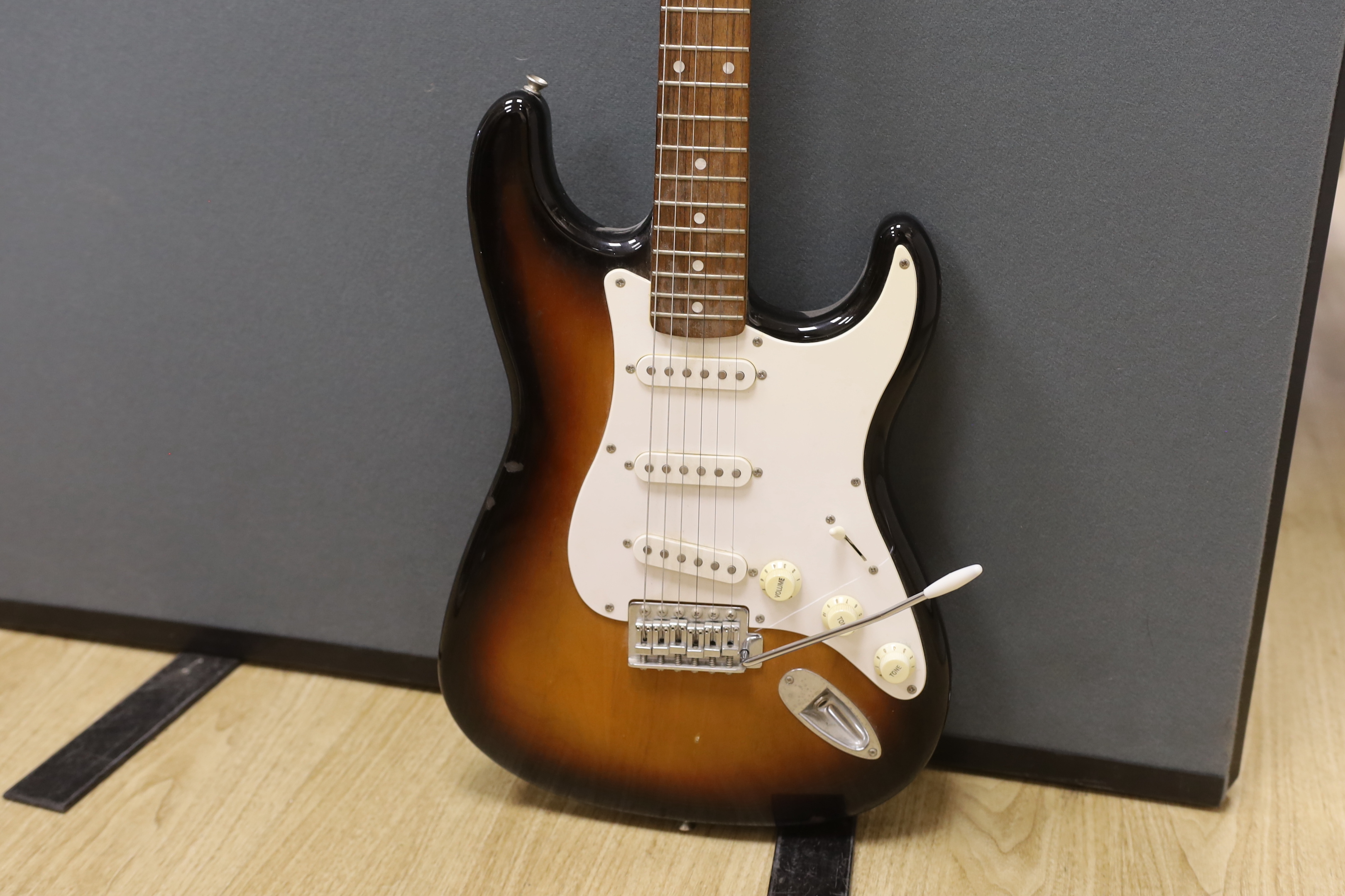 A Fender Squier 20th anniversary electric guitar with soft case